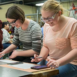female engineering students at work in the learning factory