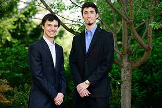 Justin Keenan (left) and Kevin Paroda posing in front of garden.